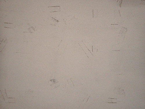 コンクリート床に残る傷跡のテクスチャー