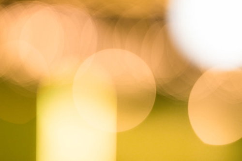 暖色のオレンジ・黄色の丸ボケ背景