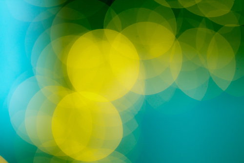 青いボケ味と黄色い丸ボケの光の写真素材グラデーション背景