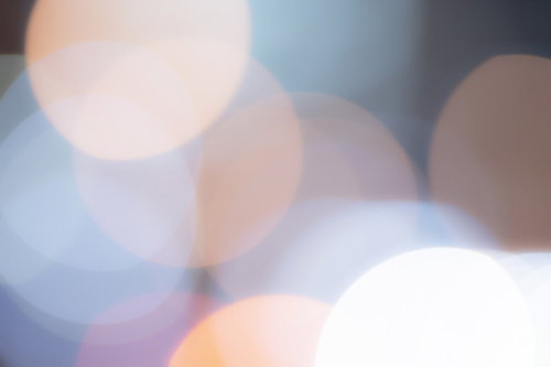 光が溢れる暖色系の丸ボケテクスチャー背景