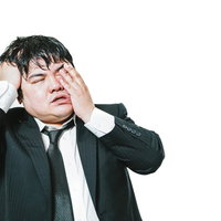 徹夜作業で昼間は眠たい会社員の疲労と過労状態の写真