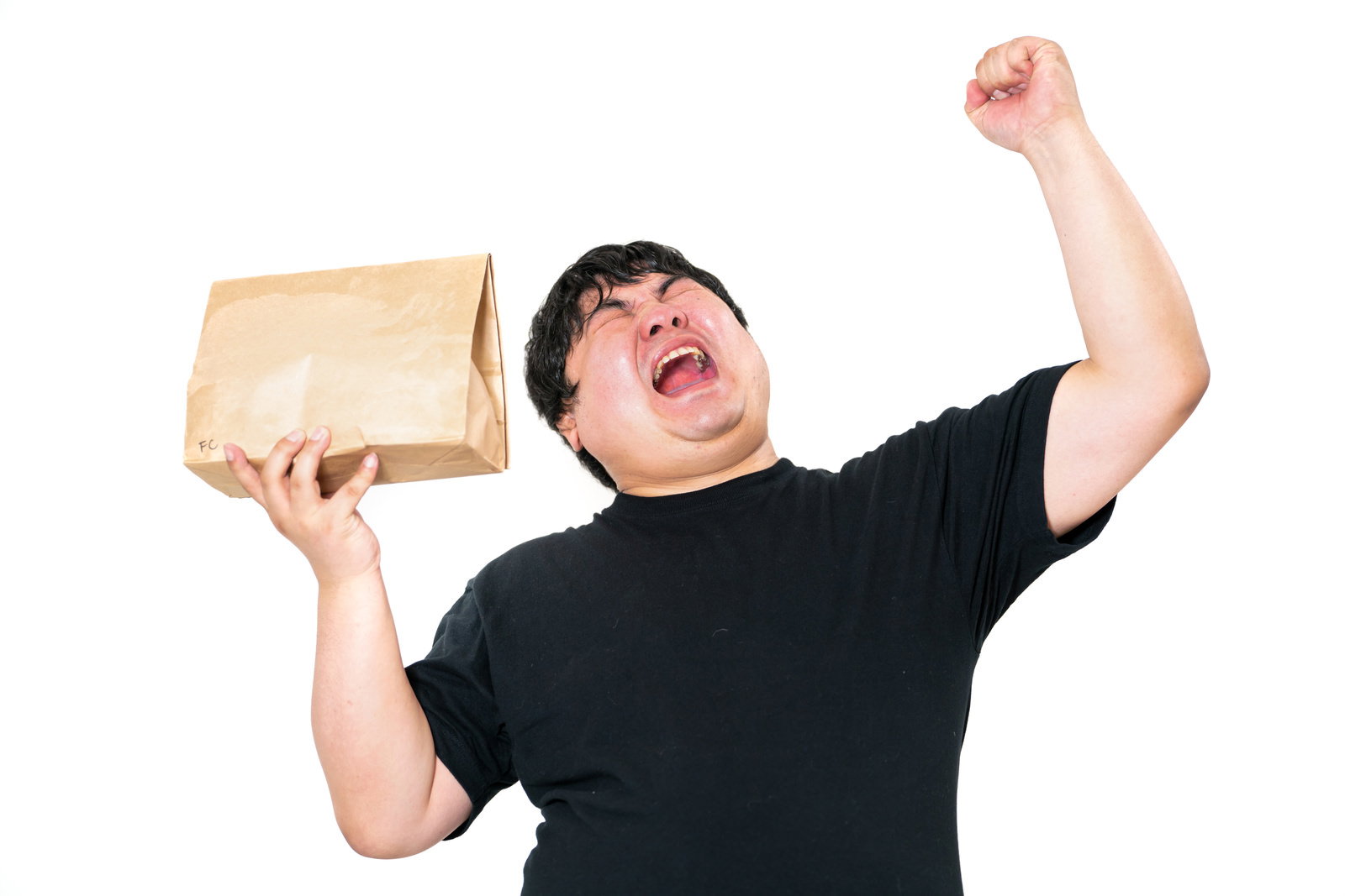 ずっと待っていた商品がようやく届いたぜ！と歓喜する男性の写真素材 