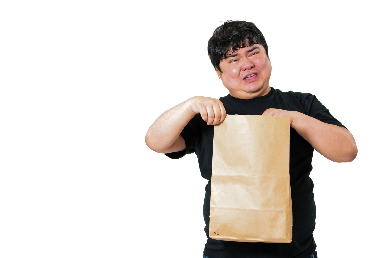 段ボール箱を前に両手で頭を抱えて困っている男性［モデル：段田隼人］