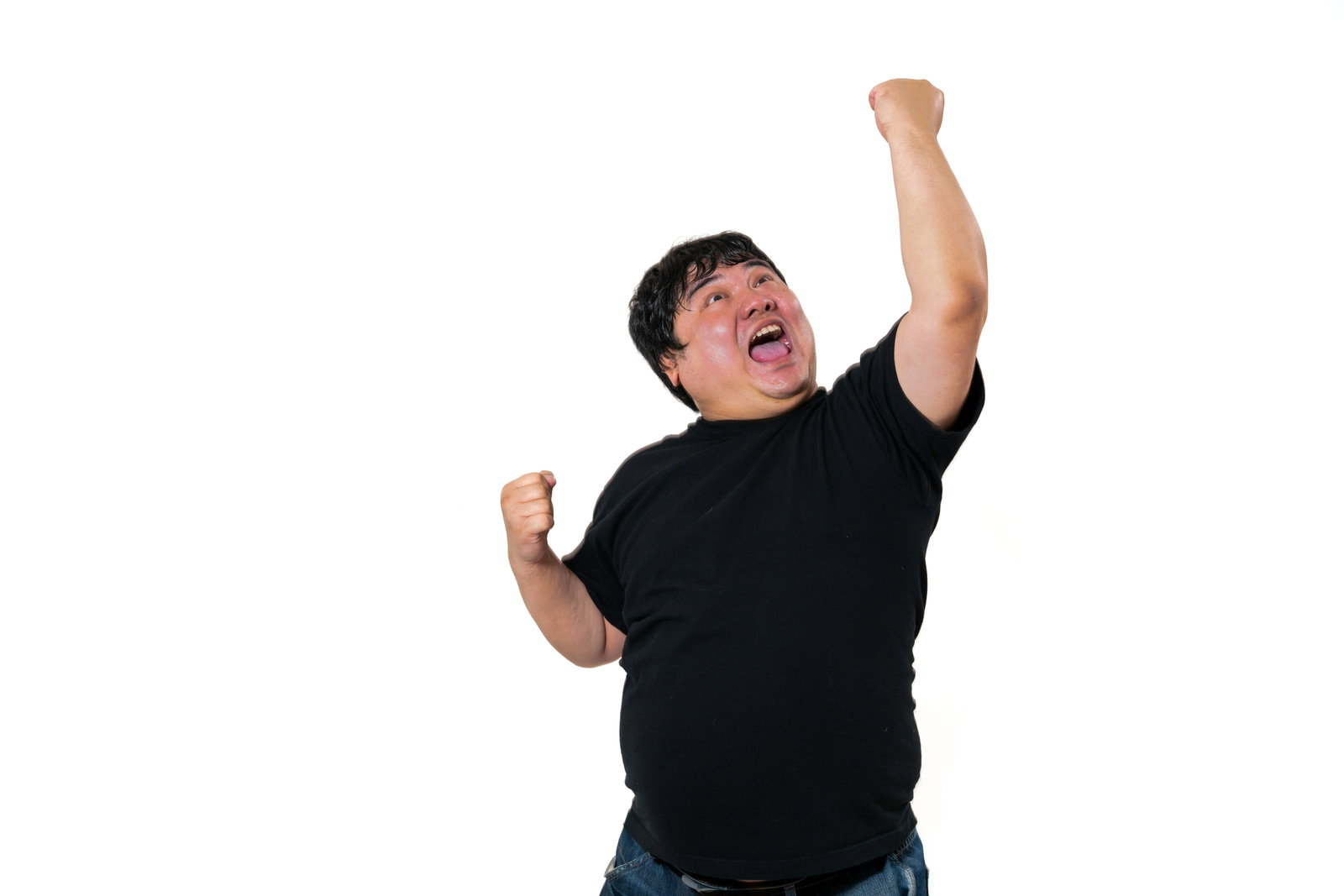 A man in a black t-shirt raising his fist and shouting