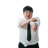 暑さで袖口をまくり上げる男性会社員の写真