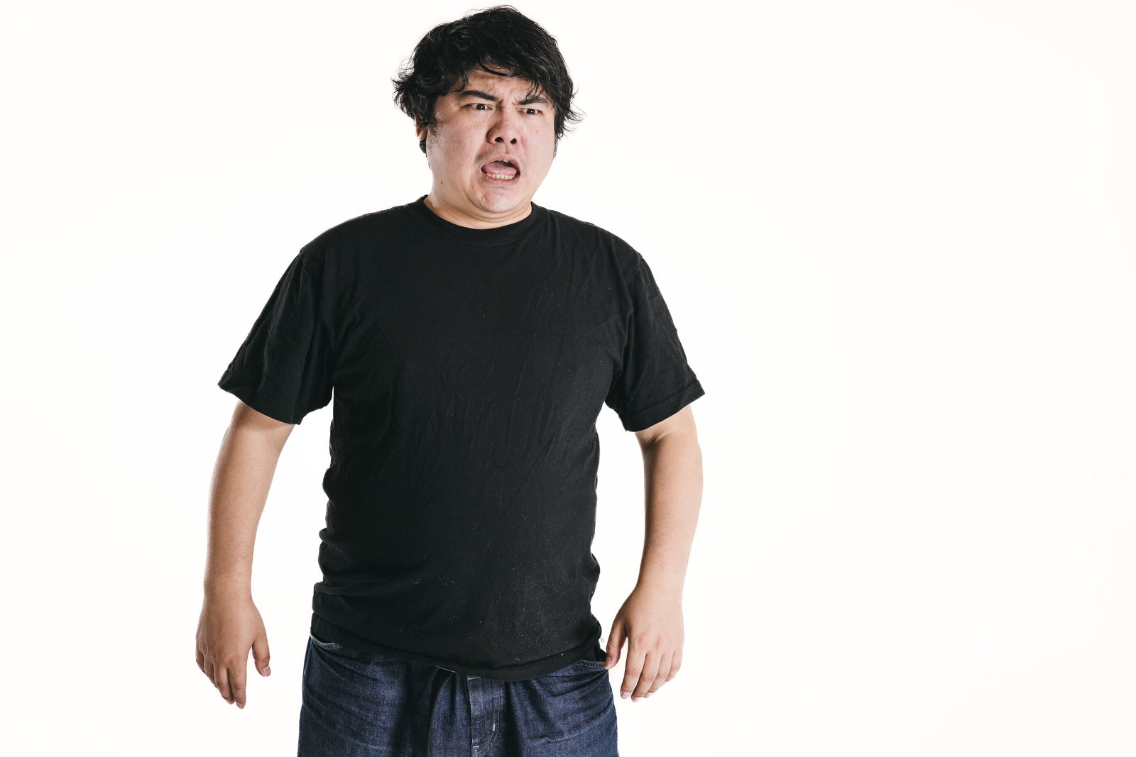 Chubby man shouting with angry expression