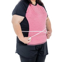 メジャーでお腹周りを測定する女性のボディサイズ確認の写真