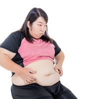 腹部の皮下脂肪を気にする女性のダイエット・体型悩みの写真