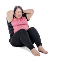 腹筋トレーニングに励むダイエット中の女性の写真