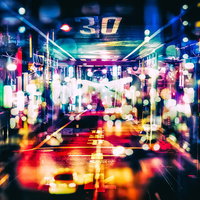 光あふれる夜の繁華街（フォトモンタージュ）の写真