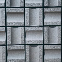 グレーのコンクリートブロックが規則正しく並ぶテクスチャーの写真