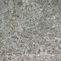 斑点模様に見えるグレーのコンクリート地面の写真