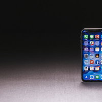 iPhone Xのホーム画面に整列するカラフルなアプリアイコンの写真