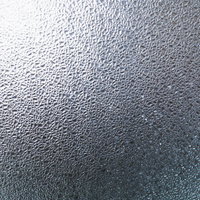 光が差し込む擦りガラスのテクスチャーの写真