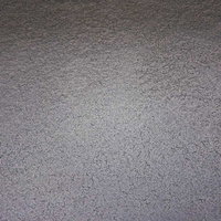 ところどころひび割れした灰色の壁のテクスチャーの写真