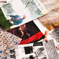 散らばった新聞記事と古い写真の調査資料の写真