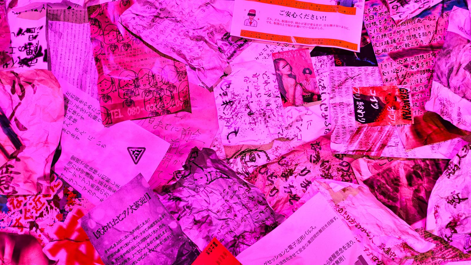 Handwritten notes and documents scattered under pink lighting
