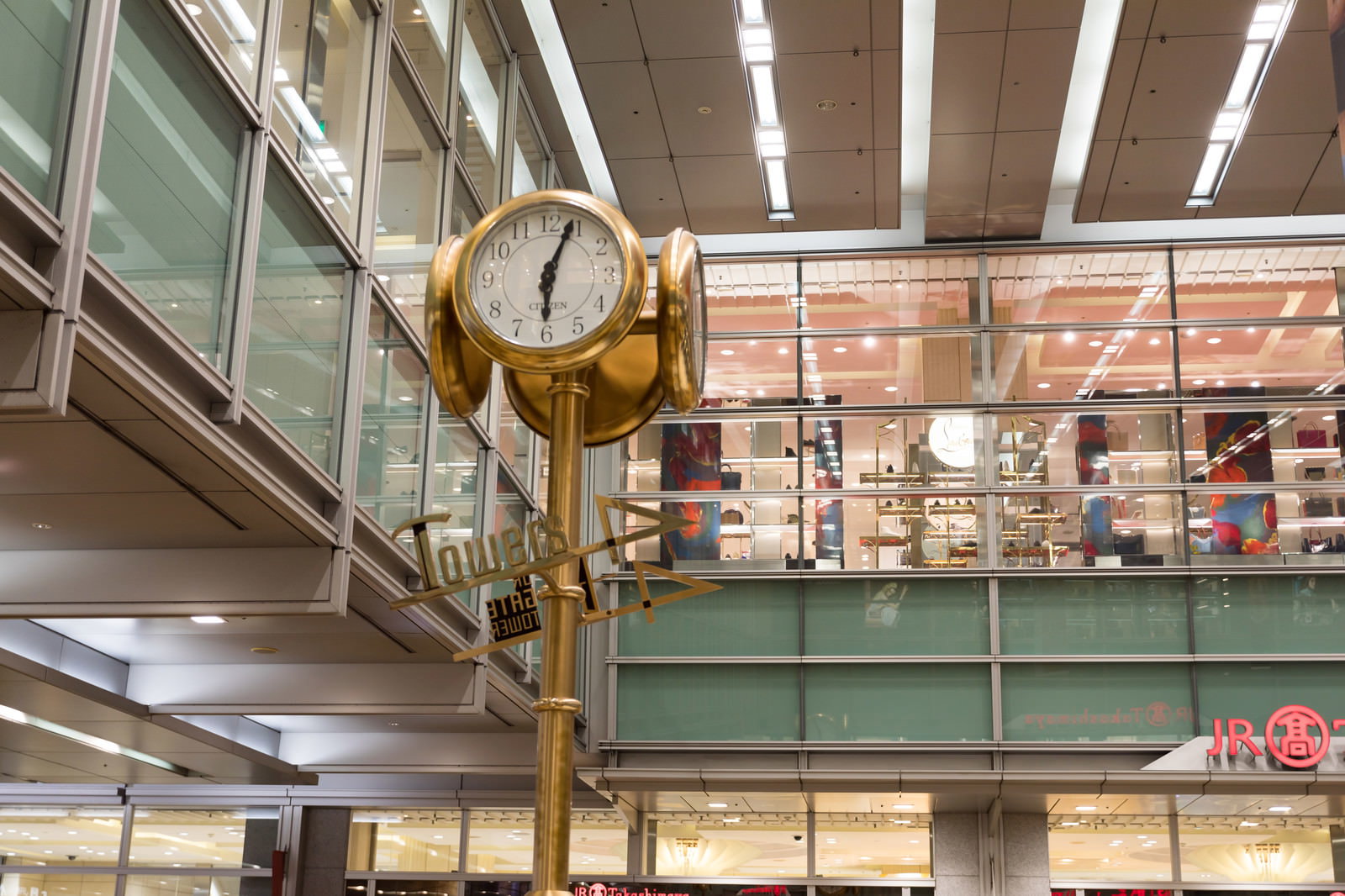 A large golden clock installed inside Nagoya Station