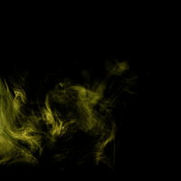 黄色く光るスモークが立ち上がる煙の抽象背景の写真