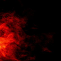 赤とオレンジに輝く燃え盛る炎とスモークの背景の写真