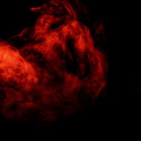 黒い背景に立ち上がる赤いスモークと炎のエフェクトの写真