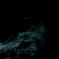 黒背景に立ち上る緑色の煙と毒ガスエフェクトの写真