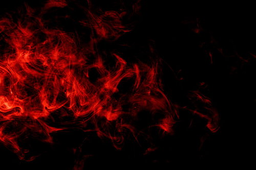 黒い背景に赤く燃え上がる炎とスモーク、太陽フレアのようなエフェクト
