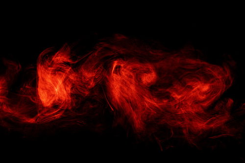 呪われてそうな赤とオレンジの炎と煙が立ち上る