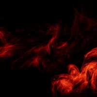 黒背景に流れる赤いスモークと炎のテクスチャの写真
