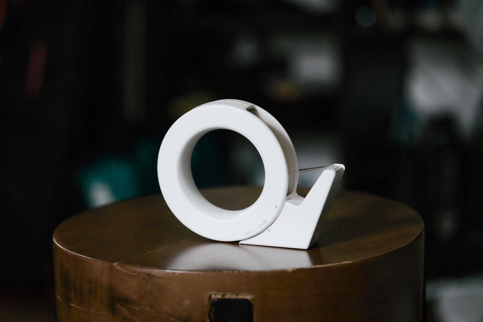 White tape dispenser on a brown stand