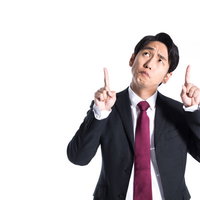 成績アップを指示する上司が不満と困惑を表現の写真