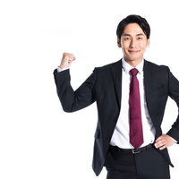 トップセールスマンの自信に満ちたガッツポーズの写真
