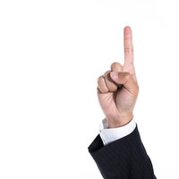 上を指差した手でナンバーワンを示すビジネスマンの写真