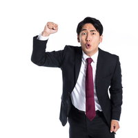 拳を振り上げて憤怒する会社員男性のビジネスの写真