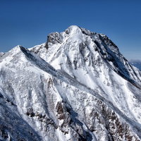 厳冬期の阿弥陀岳の雪山風景 南アルプスの険しい峰々の写真