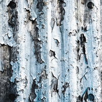 塗装の剥げたボロボロの波板テクスチャーの写真