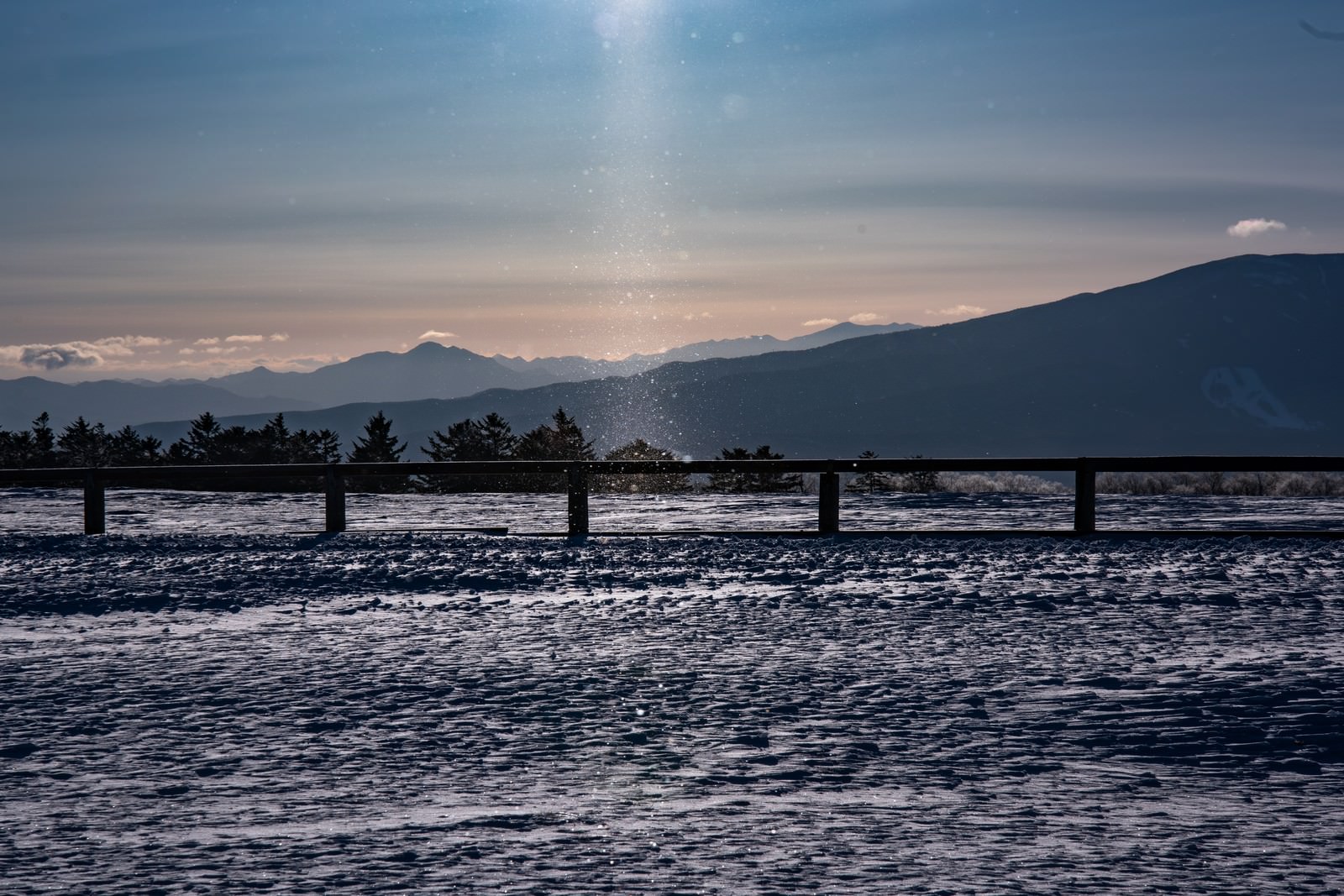 Snowy landscape with diamond dust swirling at Bijouhara Highlands