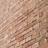 赤茶色に積み上げられたレンガの壁の質感と風合いの写真