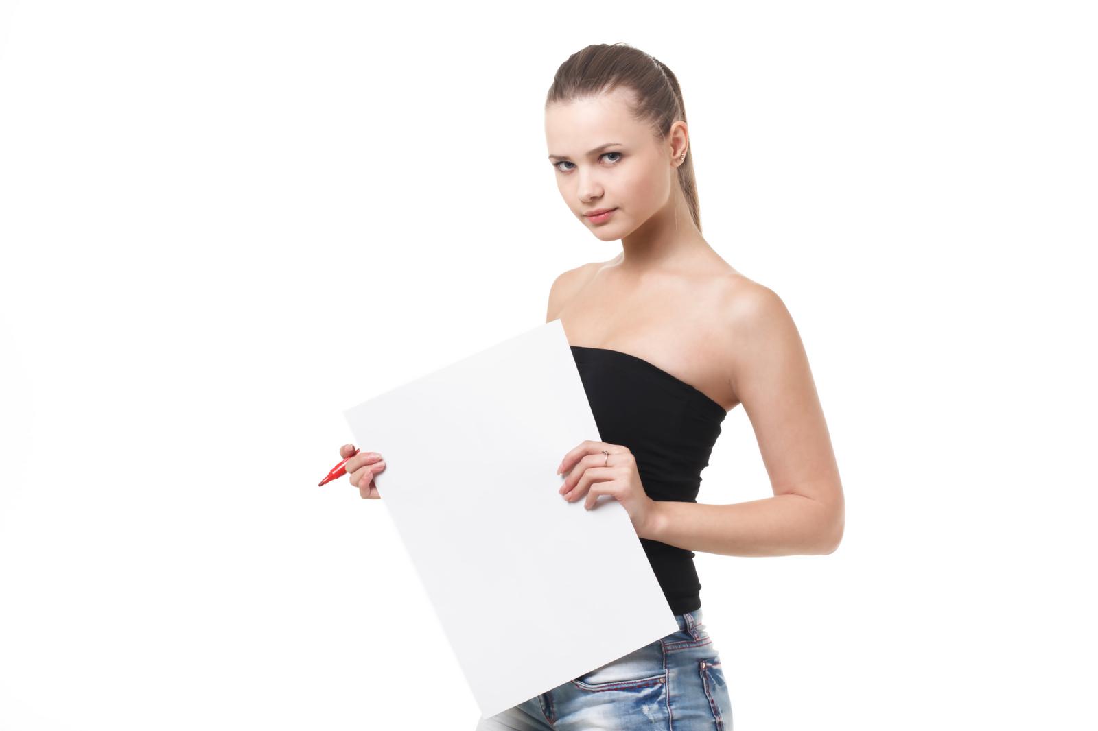 Woman in Black Crop Top Holding a White Paper and Posing