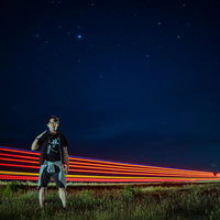 モンゴルの星空とトラックの光跡とトラベラーの写真