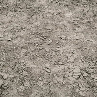 干上がりひび割れた数日前までダム湖の底だった砂地のテクスチャーの写真
