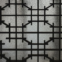 くもりガラスに浮かぶレトロな格子模様のテクスチャーの写真