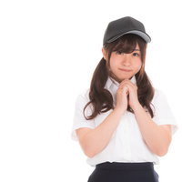 お願いするポーズの野球部女子マネージャーの写真