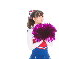 ワクワクするチアガールのポンポンと勝利の瞬間の写真