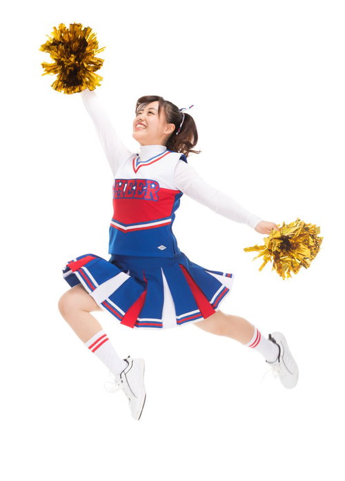 赤と青のユニフォームでポンポンを持ってジャンプする応援チアガール