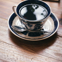 お洒落カフェのブラックコーヒーでほっと一息の写真