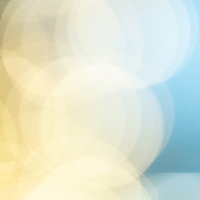 黄色と青のグラデーションに丸ボケが重なる光の表現の写真