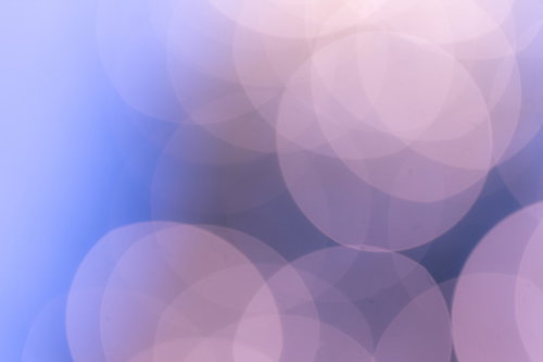 紫とピンク色のグラデーション丸ボケ光のテクスチャー背景