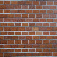 茶色のレンガ調タイル壁テクスチャの写真