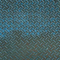 使い込まれたチェッカープレート（縞板）のテクスチャーの写真